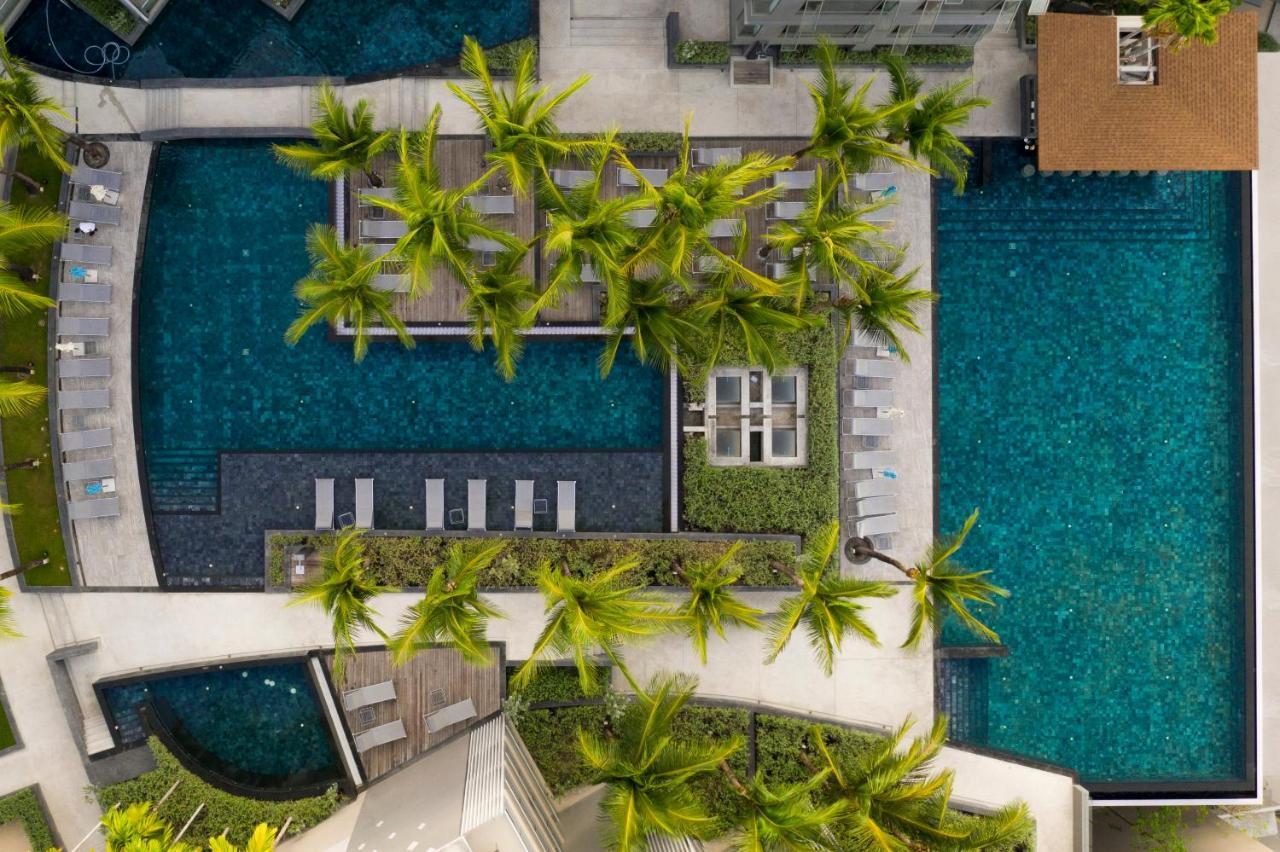 Oceanfront Beach Resort - Sha Extra Plus Patong Eksteriør billede Aerial view of the pool at the hotel